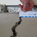 Cracked Foundation being Measured with a Ruler